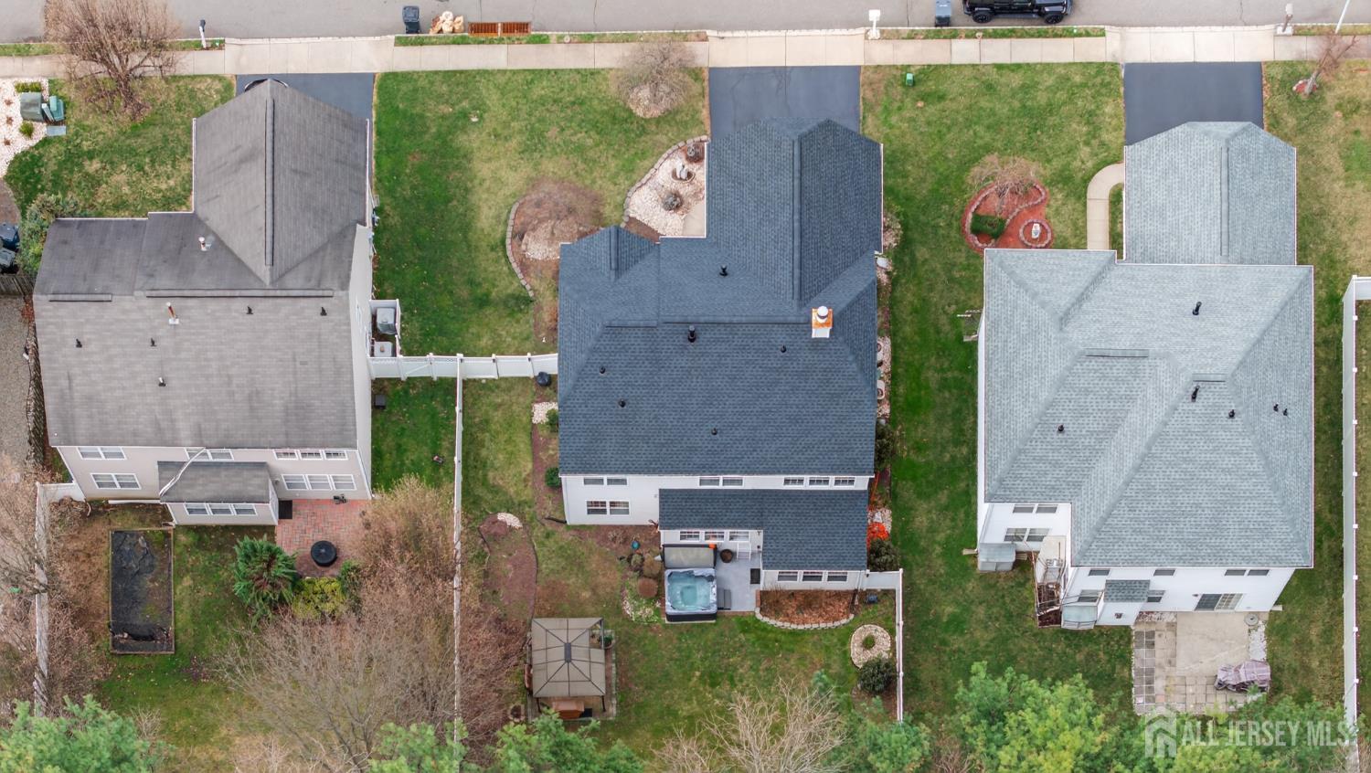 351 Wedgewood Road Morganville, NJ 07751 - Photo 21 of 74 an aerial view of multiple houses with outdoor space