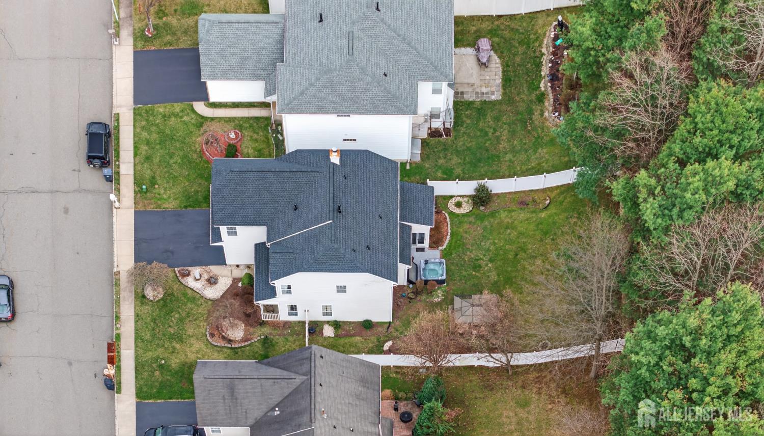 351 Wedgewood Road Morganville, NJ 07751 - Photo 23 of 74 an aerial view of multiple houses with outdoor space