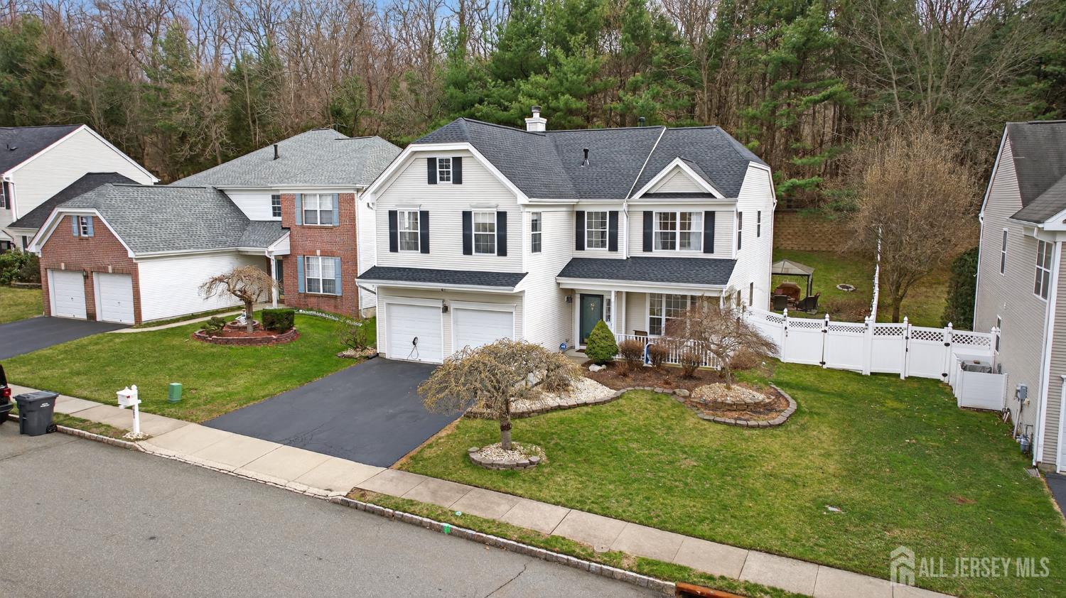 351 Wedgewood Road Morganville, NJ 07751 - Photo 26 of 74 a aerial view of a house with garden