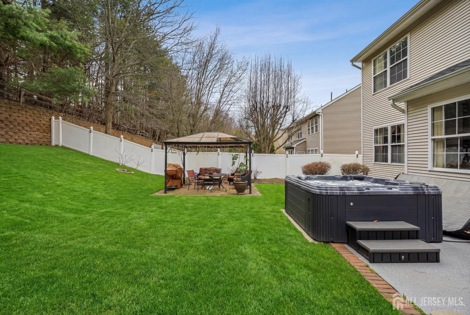 351 Wedgewood Road Morganville, NJ 07751 - Photo 31 of 74 a view of backyard with seating area and green space