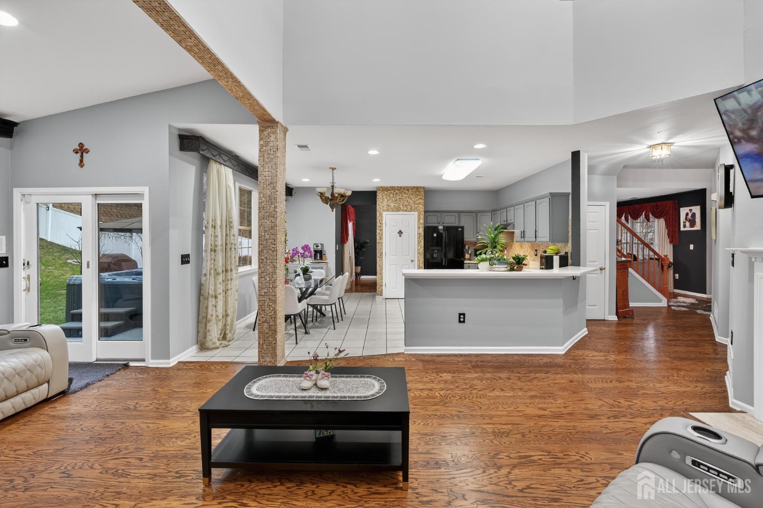 351 Wedgewood Road Morganville, NJ 07751 - Photo 39 of 74 a living room with furniture and a wooden floor