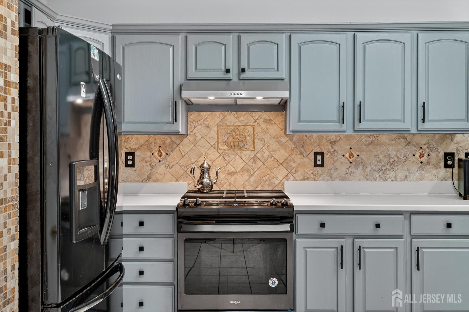 351 Wedgewood Road Morganville, NJ 07751 - Photo 42 of 74 a kitchen with stainless steel appliances granite countertop a refrigerator stove and sink