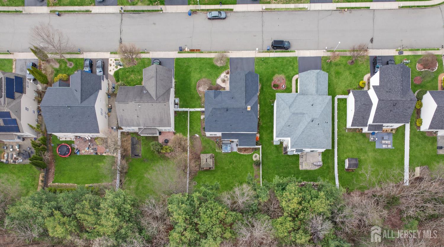 351 Wedgewood Road Morganville, NJ 07751 - Photo 5 of 74 an aerial view of multiple house with outdoor space and a swimming pool