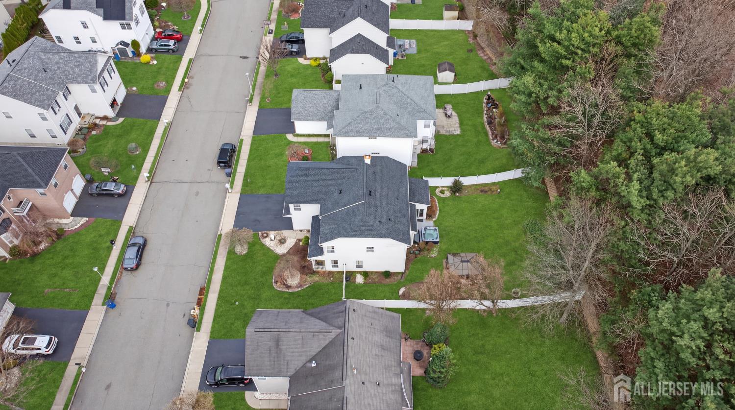 351 Wedgewood Road Morganville, NJ 07751 - Photo 6 of 74 an aerial view of a house with a garden
