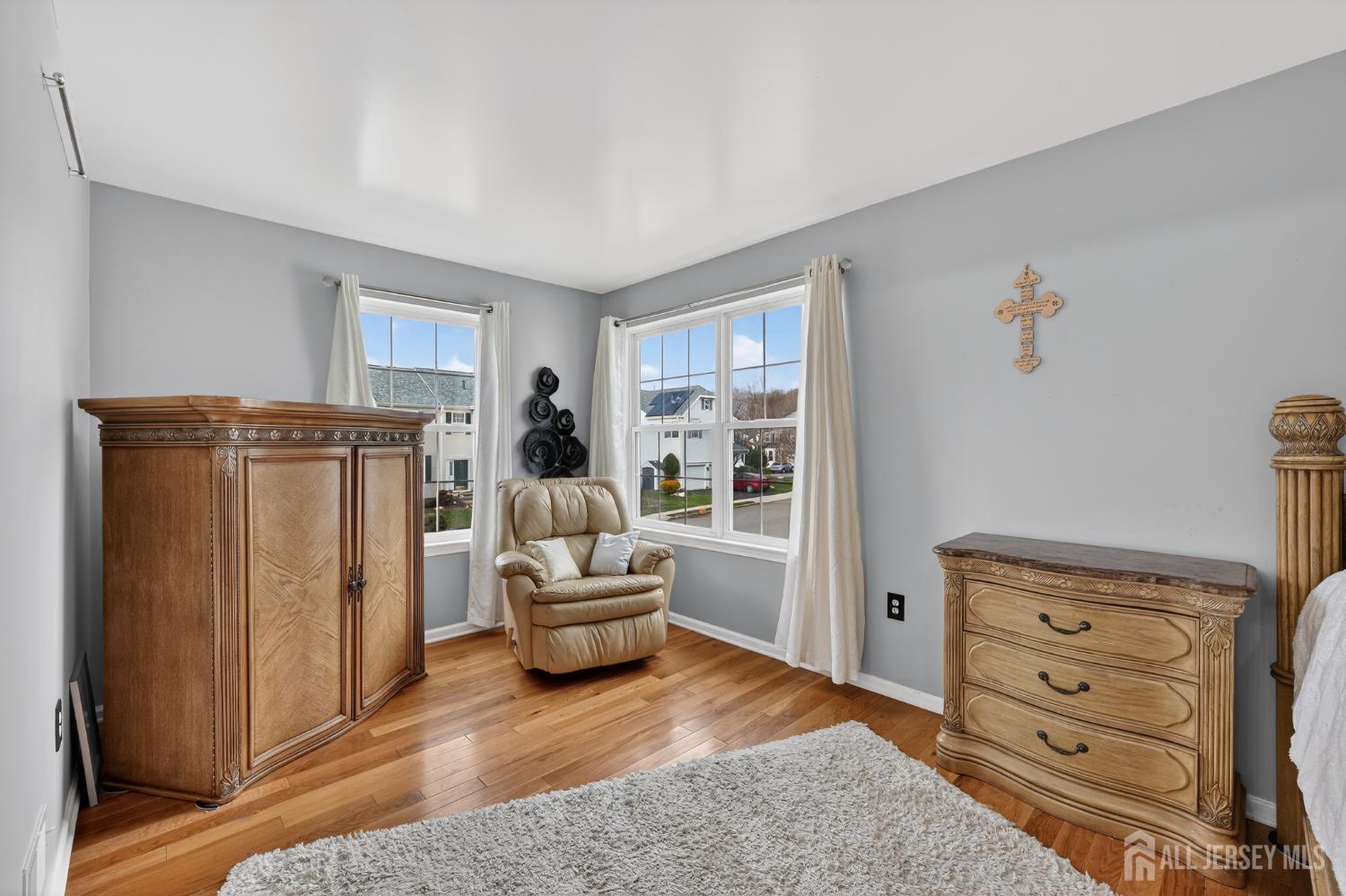 351 Wedgewood Road Morganville, NJ 07751 - Photo 65 of 74 a living room with furniture and a dresser