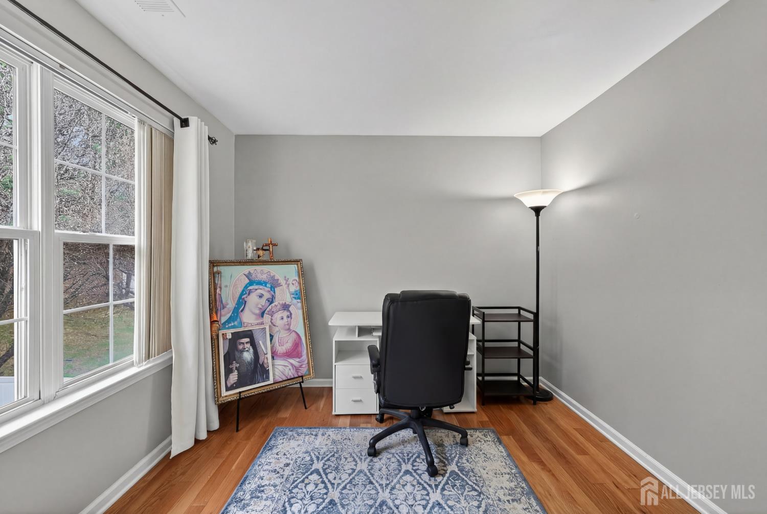 351 Wedgewood Road Morganville, NJ 07751 - Photo 69 of 74 a view of workspace with wooden floor windows
