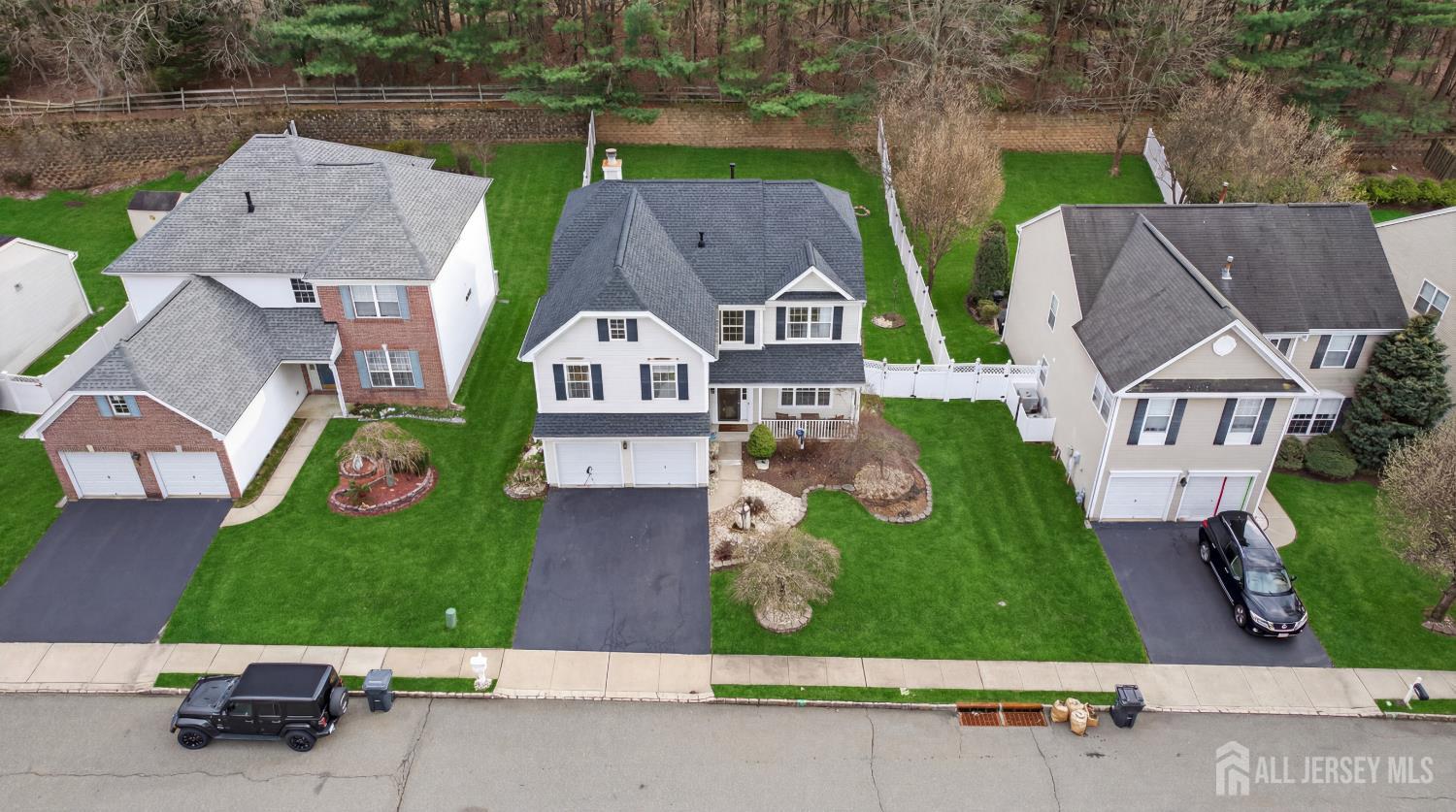 351 Wedgewood Road Morganville, NJ 07751 - Photo 10 of 74 an aerial view of multiple houses with a yard