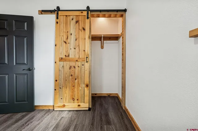 a view of front door with wooden floor