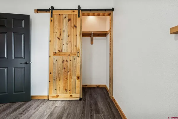 a view of front door with wooden floor