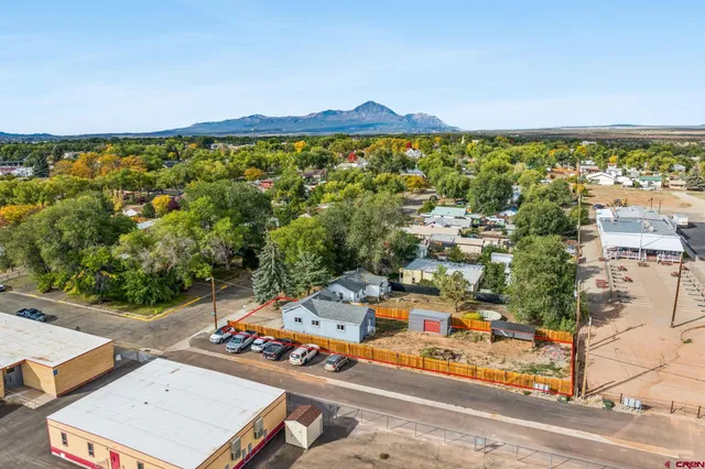 an aerial view of a house with a ocean view