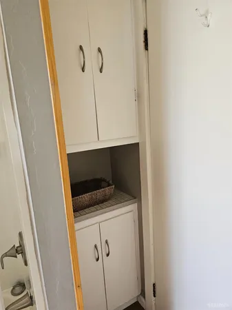 a utility room with a sink a washer and dryer