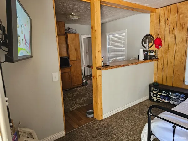 a bedroom with a bed and cabinets