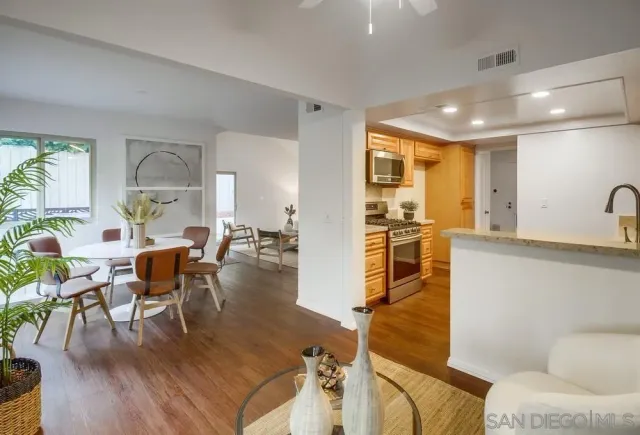 a kitchen with stainless steel appliances granite countertop a stove and a refrigerator