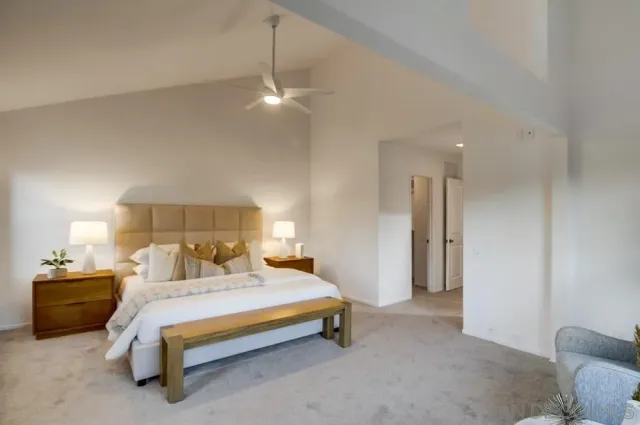 a bed room with a bed and a lamp