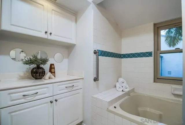 a bathroom with a shower and a tub