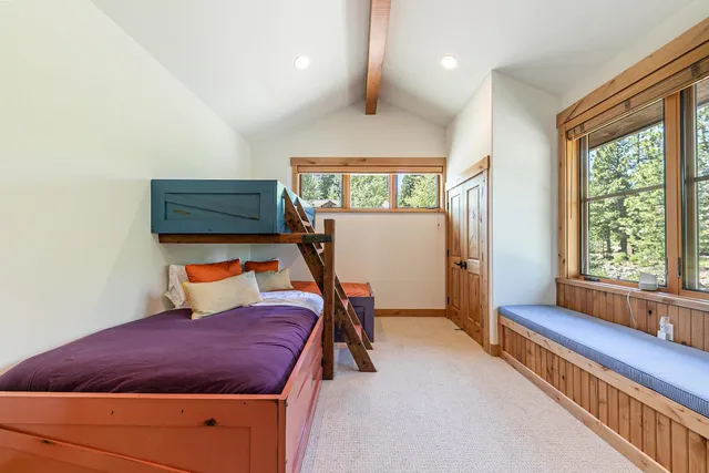 a bed room with a bed and a window