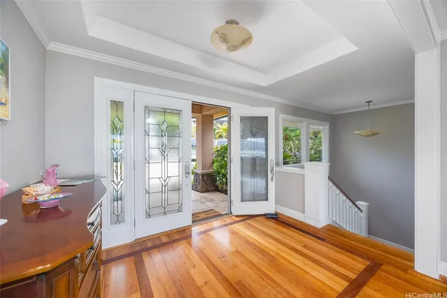 a room with wooden floor and window