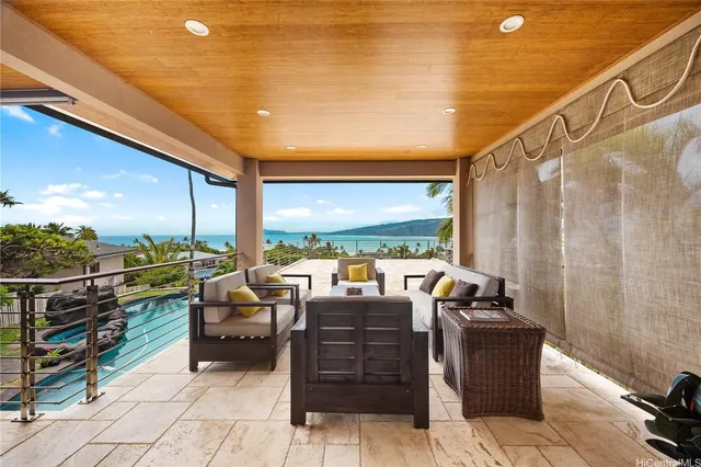 a view of roof deck with furniture