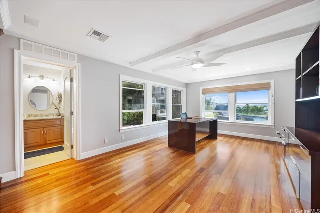 a view of workspace with wooden floor and windows