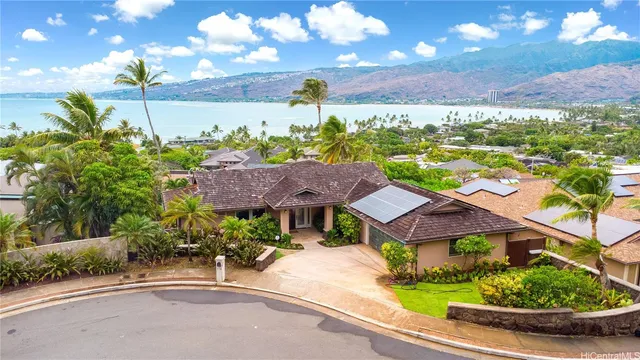 a view of a house with a yard and a garden