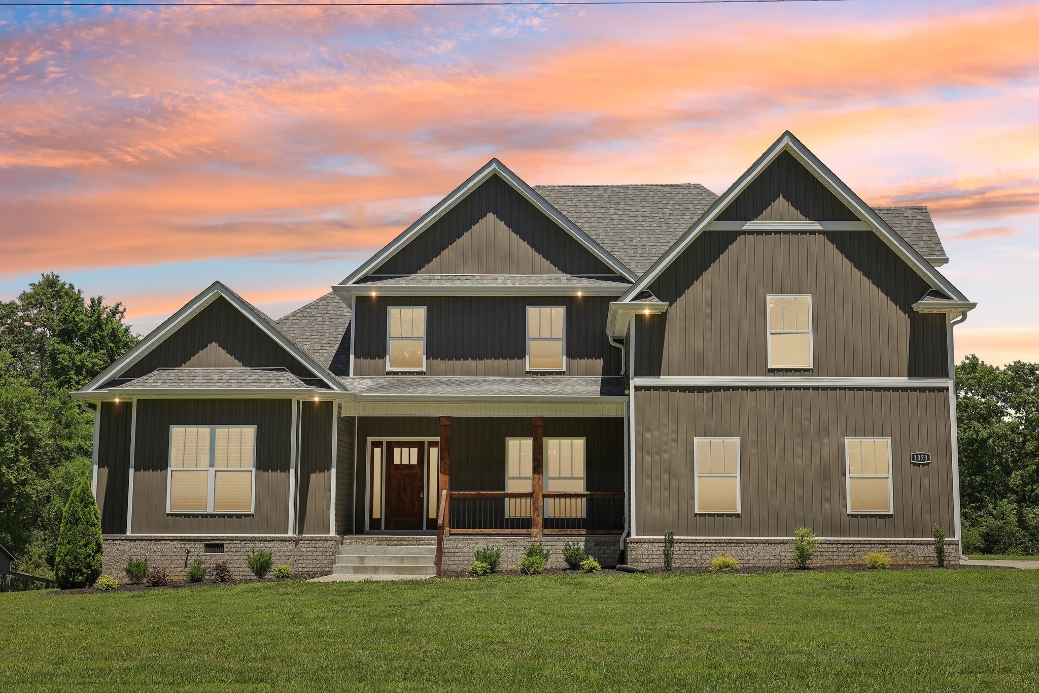 front view of a house with a yard