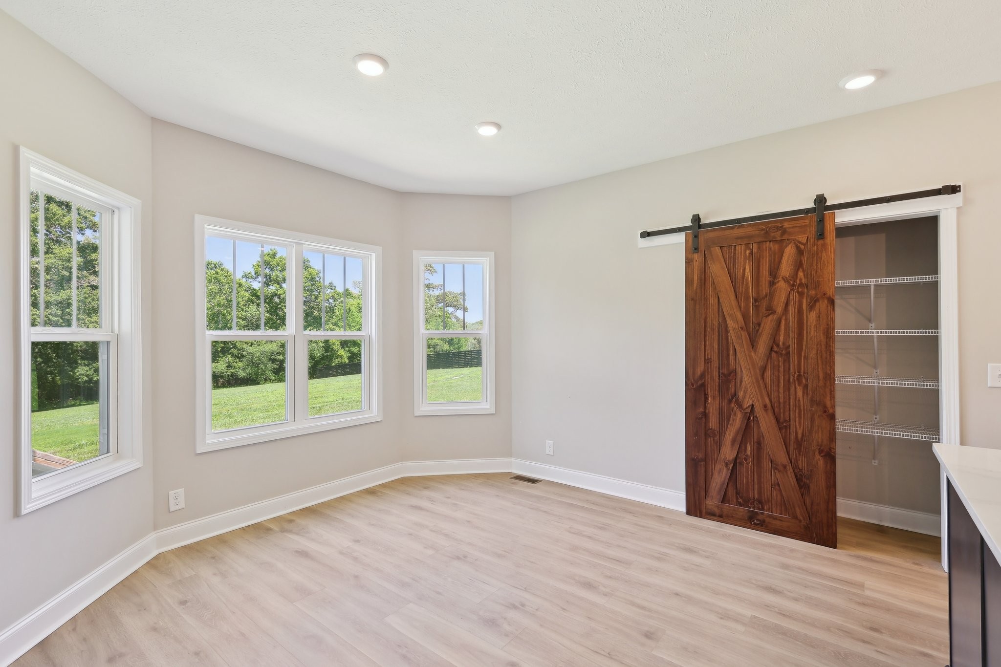 1373 Southside Road Southside, TN 37171 - Photo 12 of 56 a view of an empty room with a window and wooden floor
