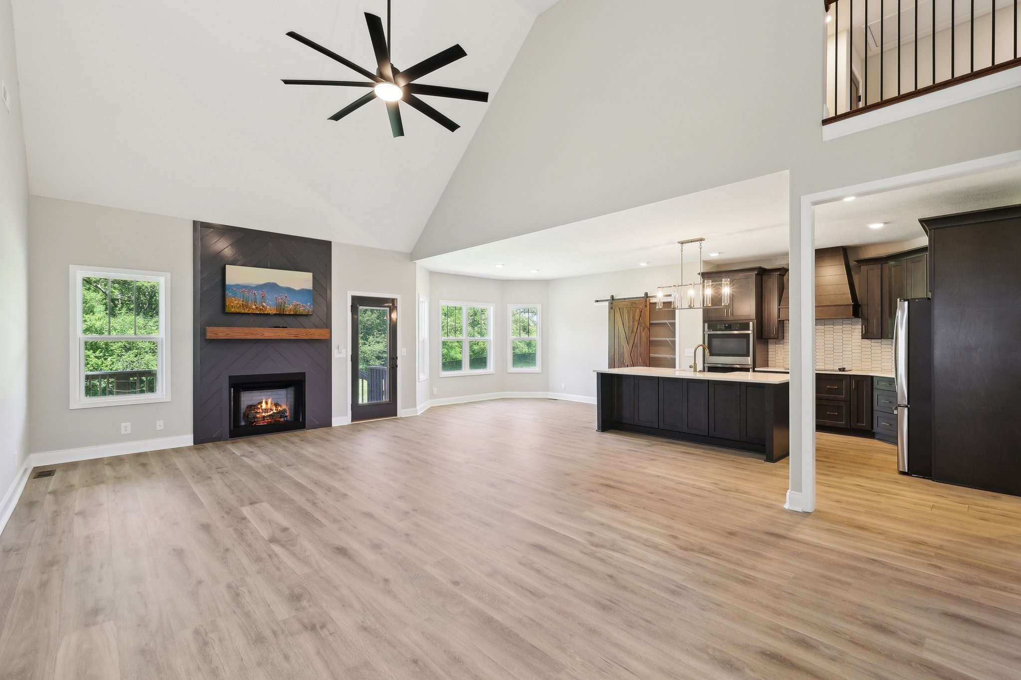 1373 Southside Road Southside, TN 37171 - Photo 5 of 56 a view of a room with kitchen and fireplace wooden floor