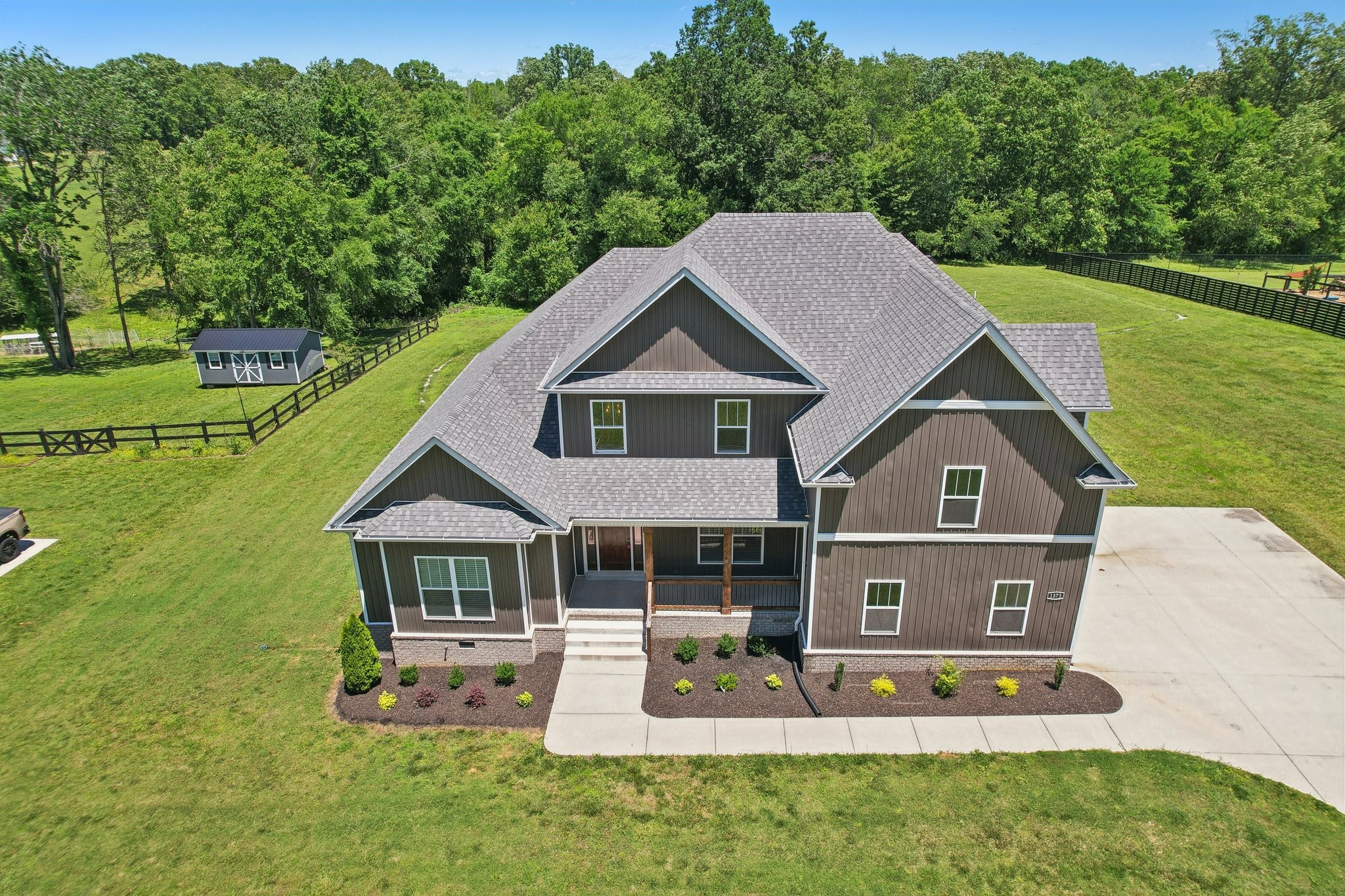 1373 Southside Road Southside, TN 37171 - Photo 52 of 56 a front view of a house with a yard table and chairs