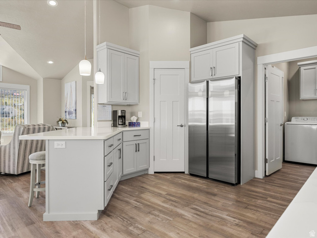 608 Fremont Road Fish Haven, ID 83287 - Photo 17 of 35 Modern kitchen featuring light gray cabinetry, stainless steel appliances, and wood-finish flooring