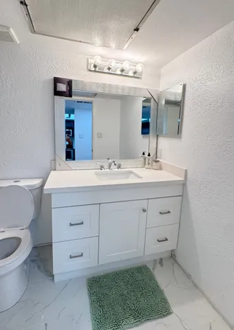 a bathroom with a sink a toilet and a bathtub