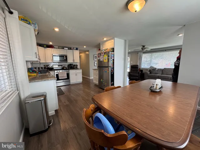 a view of kitchen dining table and chairs