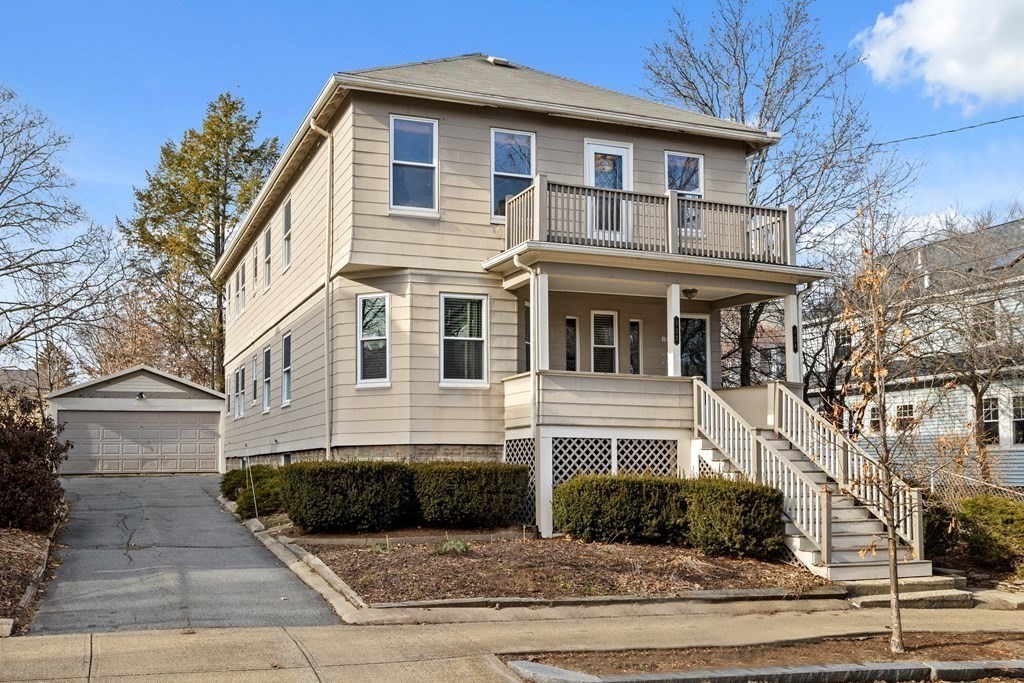 132 Rawson Road, Unit 132 Arlington, MA 02474 - Photo 26 of 26 a front view of a house with garage