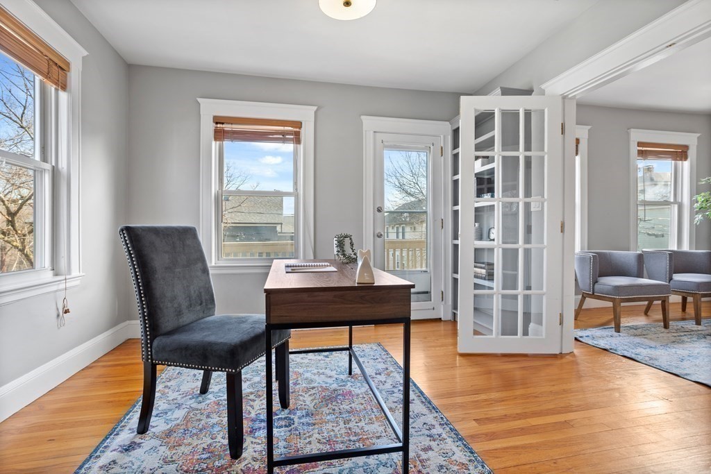 132 Rawson Road, Unit 132 Arlington, MA 02474 - Photo 5 of 26 a view of a livingroom with furniture and a window