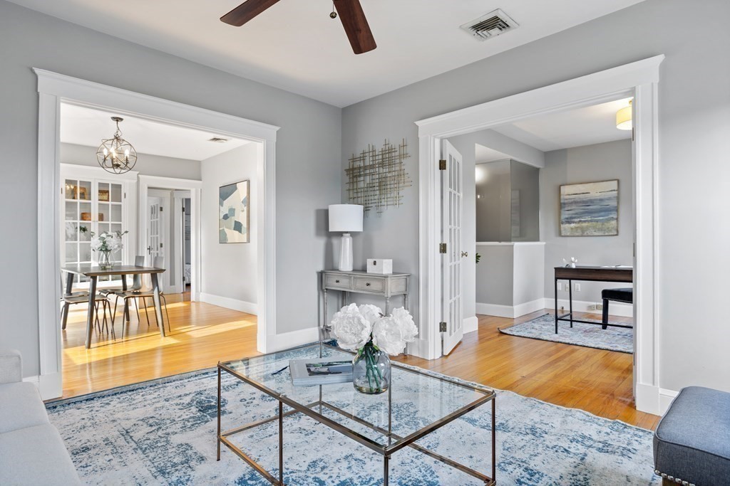 132 Rawson Road, Unit 132 Arlington, MA 02474 - Photo 10 of 26 a living room with furniture and a table