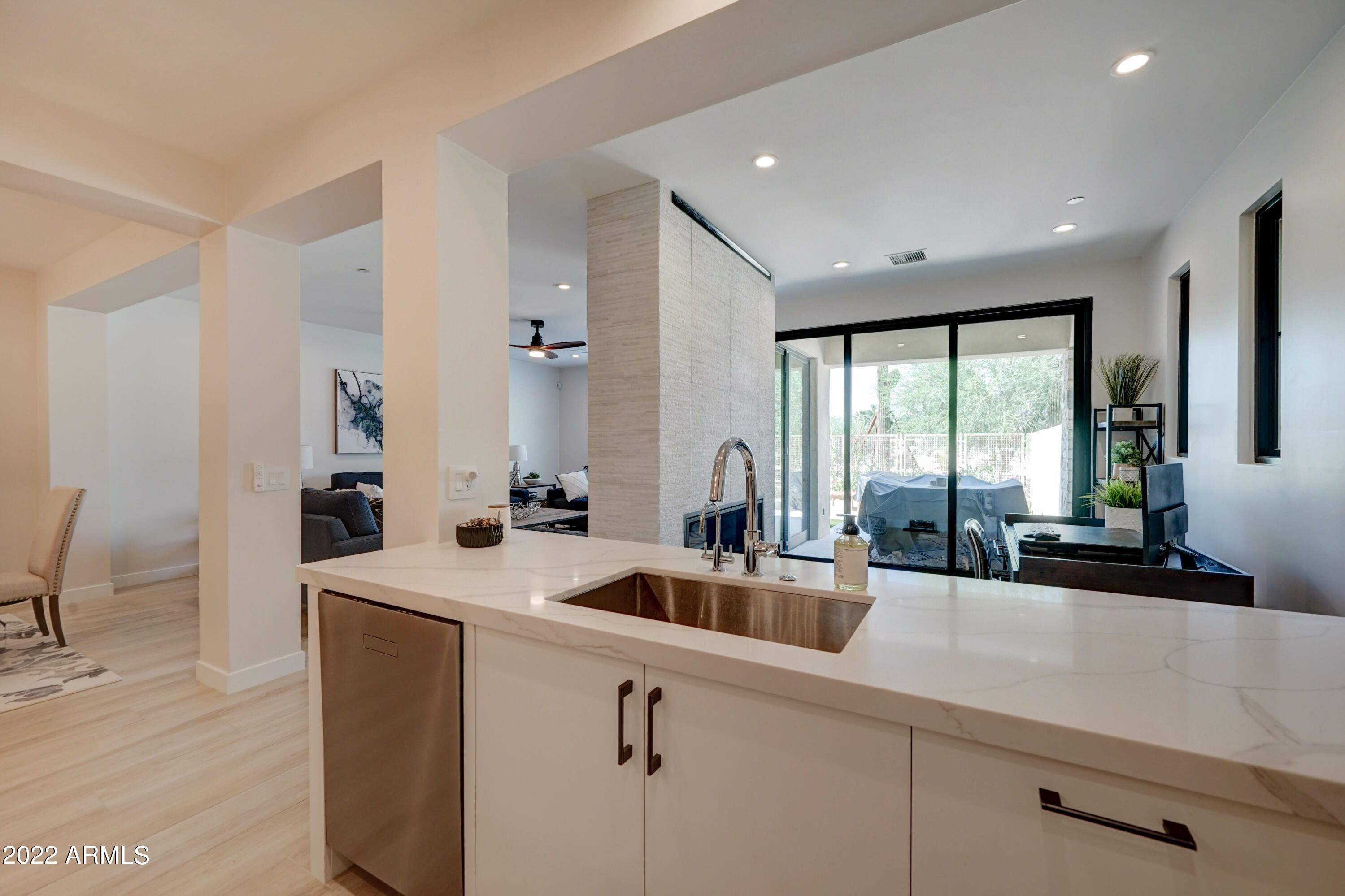 6500 East Camelback Road, Unit 1006 Scottsdale, AZ 85251 - Photo 13 of 38 a kitchen with sink a large window and stainless steel appliances