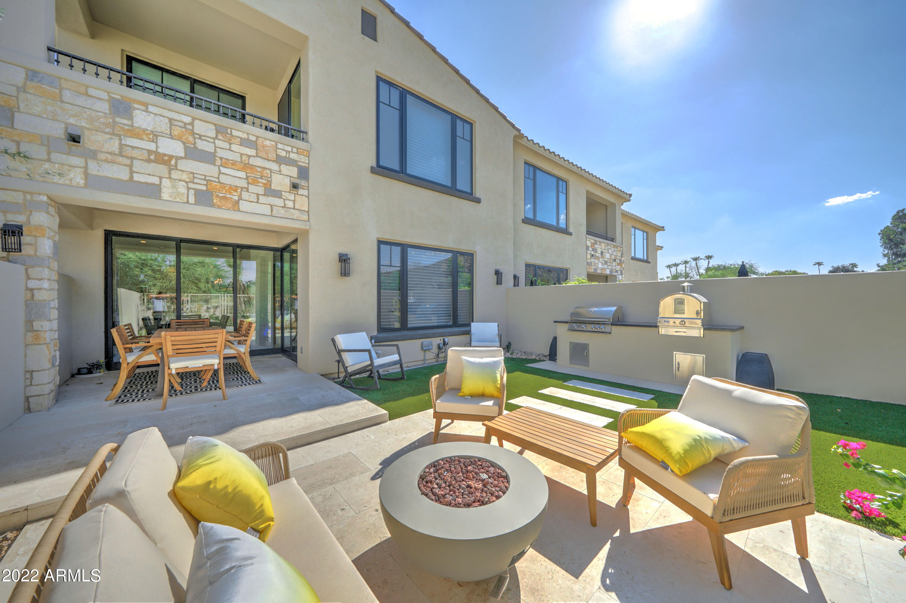 6500 East Camelback Road, Unit 1006 Scottsdale, AZ 85251 - Photo 36 of 38 a view of a house with swimming pool and furniture