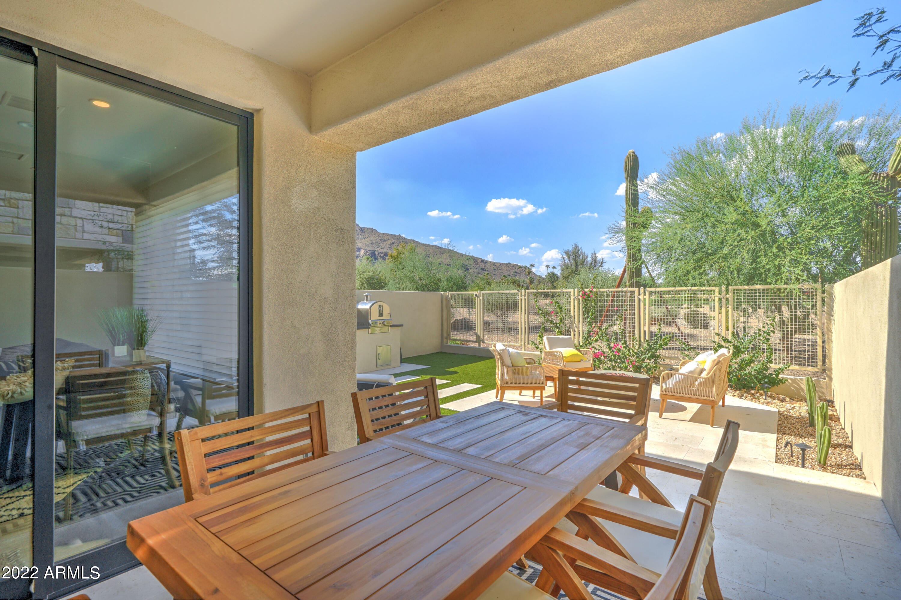6500 East Camelback Road, Unit 1006 Scottsdale, AZ 85251 - Photo 37 of 38 a outdoor space with lots of chairs and a couch