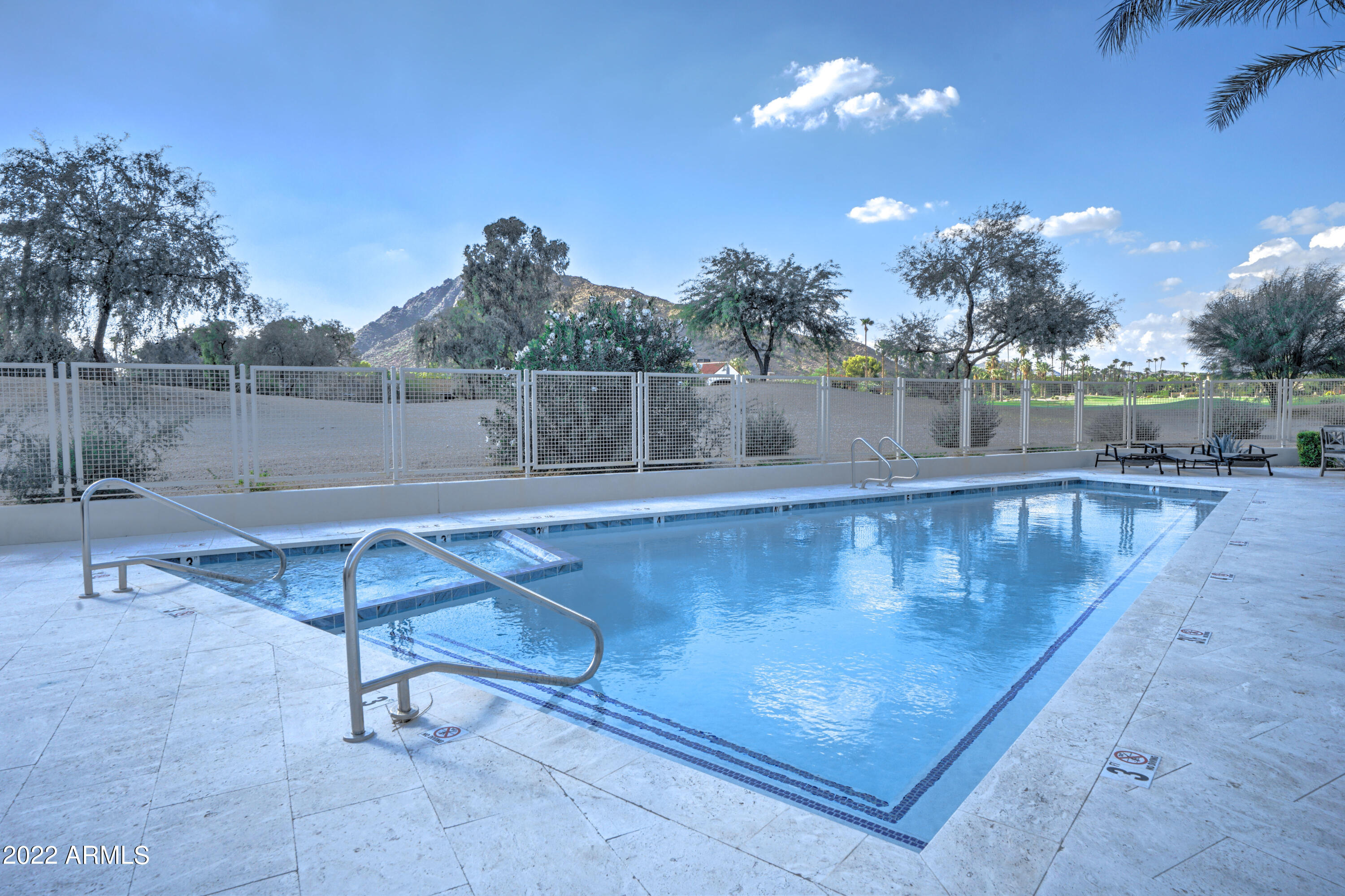 6500 East Camelback Road, Unit 1006 Scottsdale, AZ 85251 - Photo 38 of 38 a view of a swimming pool with a patio and a yard