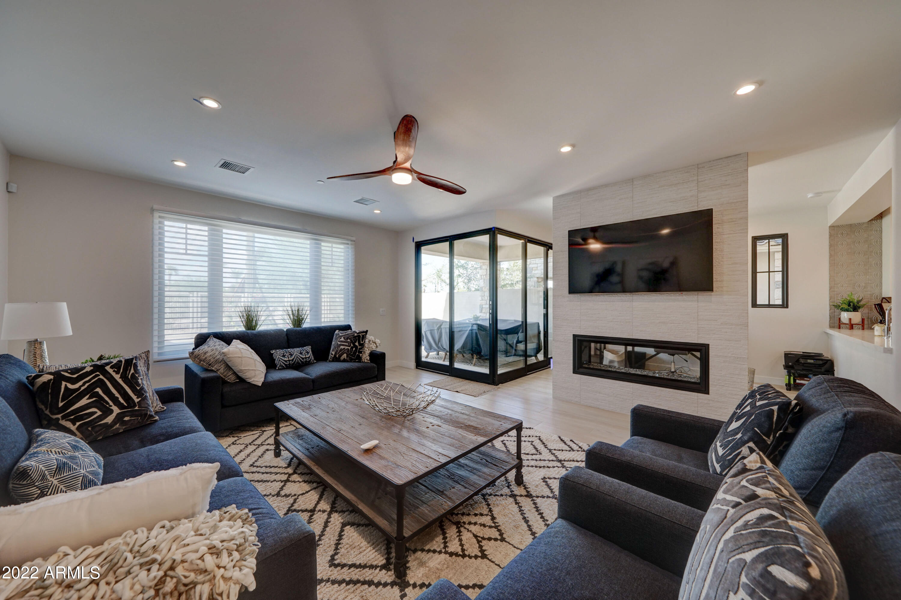 6500 East Camelback Road, Unit 1006 Scottsdale, AZ 85251 - Photo 6 of 38 a living room with furniture ceiling fan and a wooden floor