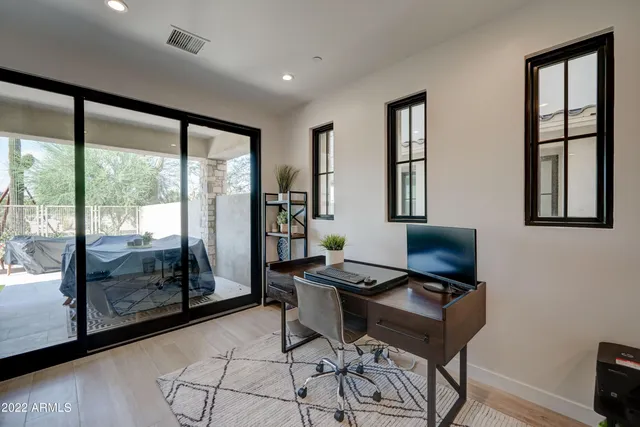 a workspace with furniture and window