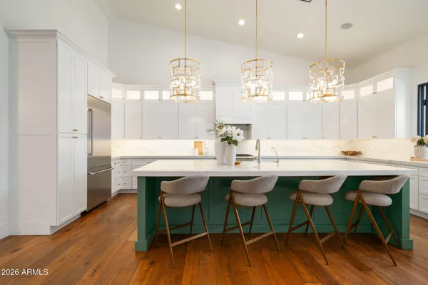 a kitchen with a table and chairs in it