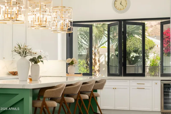 a view of a dining room with furniture and a window