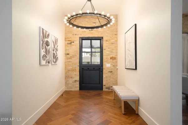 a view of a livingroom with wooden floor and a window