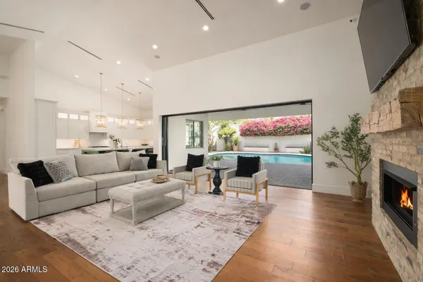 a living room with fireplace furniture and a flat screen tv