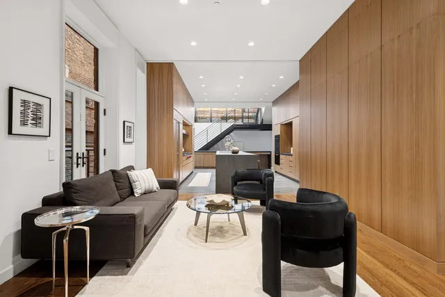 a living room with furniture and a painting