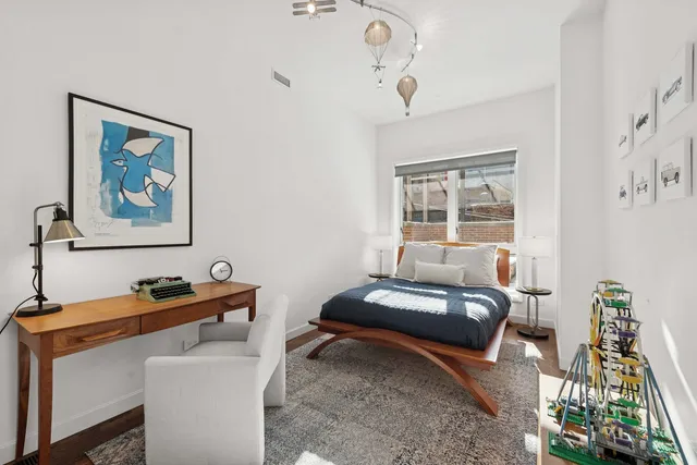 a bed room with a bed and a tv