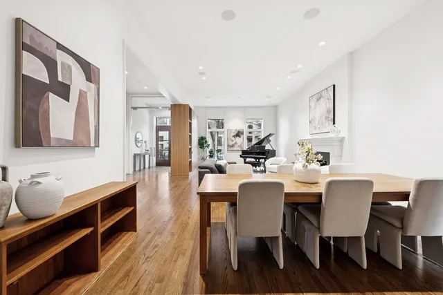a large kitchen with a table and chairs