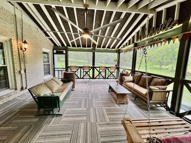 a view of a wooden deck with a yard