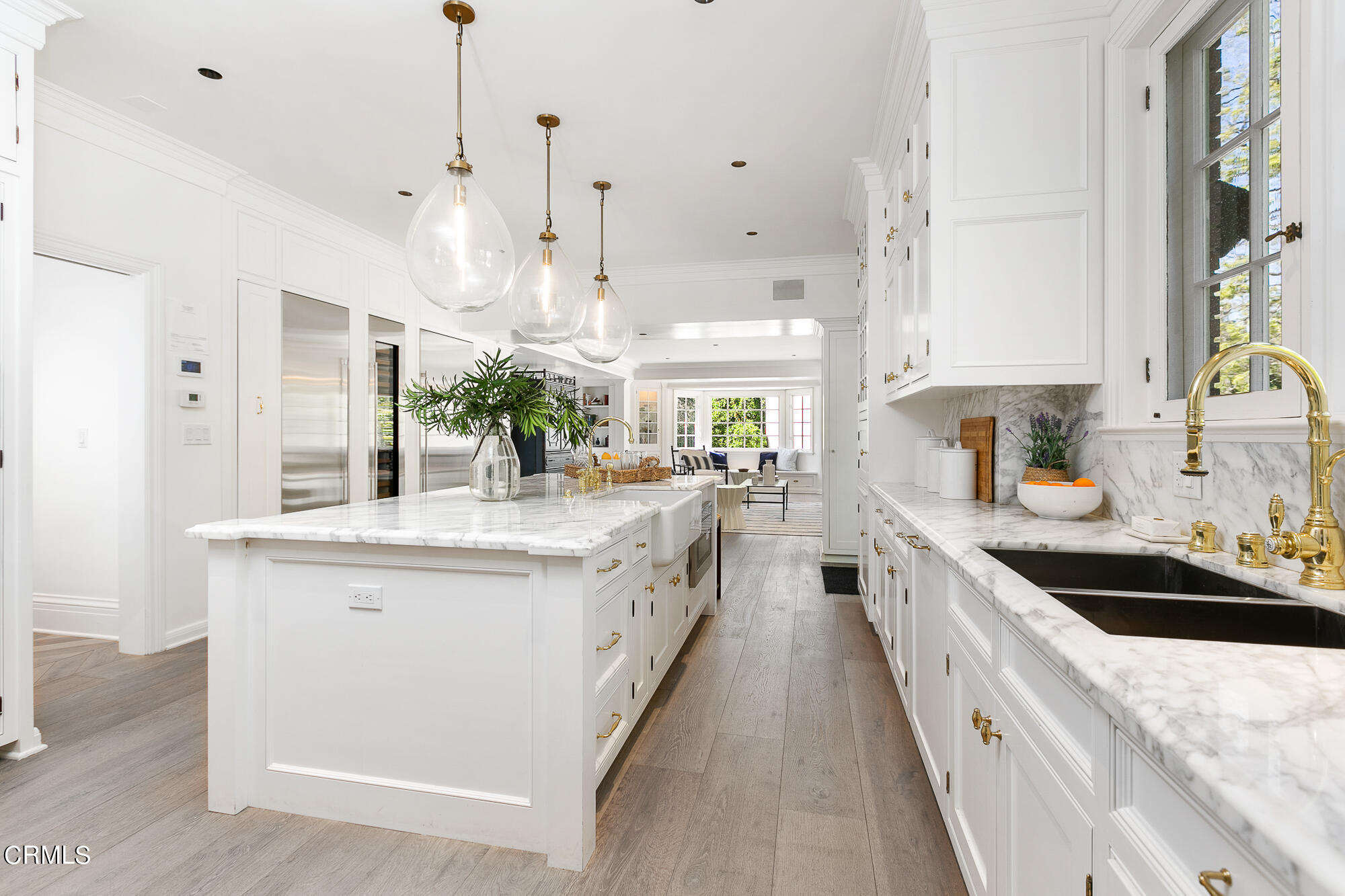 445 Prospect Square Pasadena, CA 91103 - Photo 17 of 55 a large kitchen with kitchen island a sink a counter top space and living room view