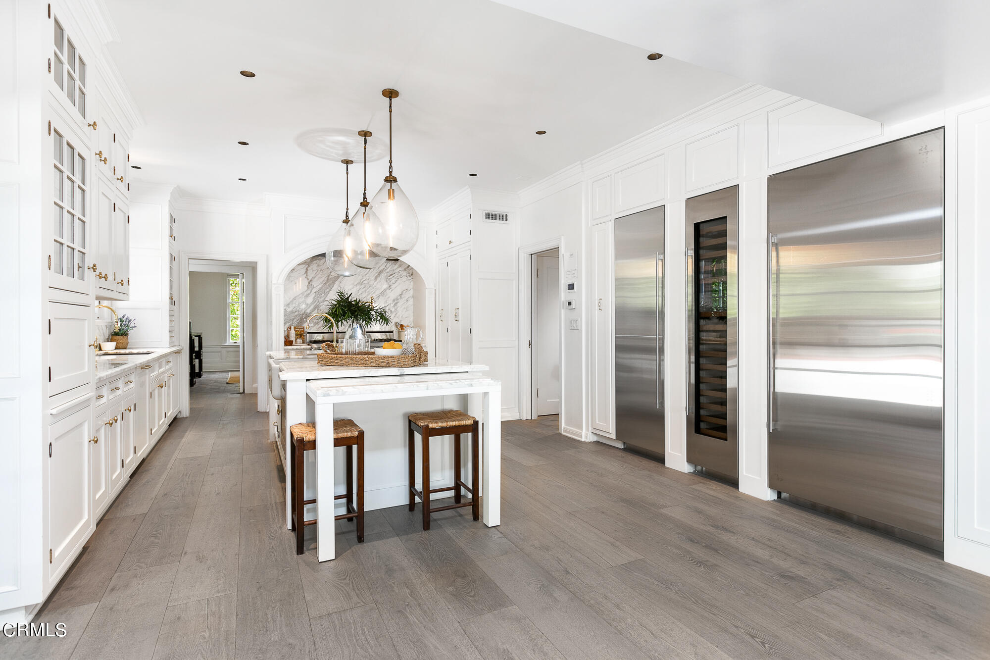 445 Prospect Square Pasadena, CA 91103 - Photo 20 of 55 a kitchen with kitchen island a counter top space a sink stainless steel appliances and cabinets
